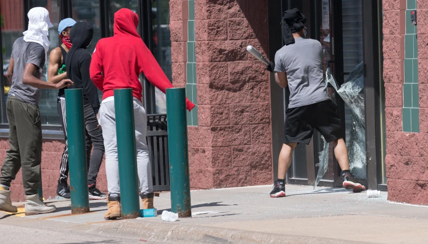 Criminals smashing a window